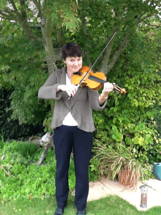 Playing the violin in the garden
